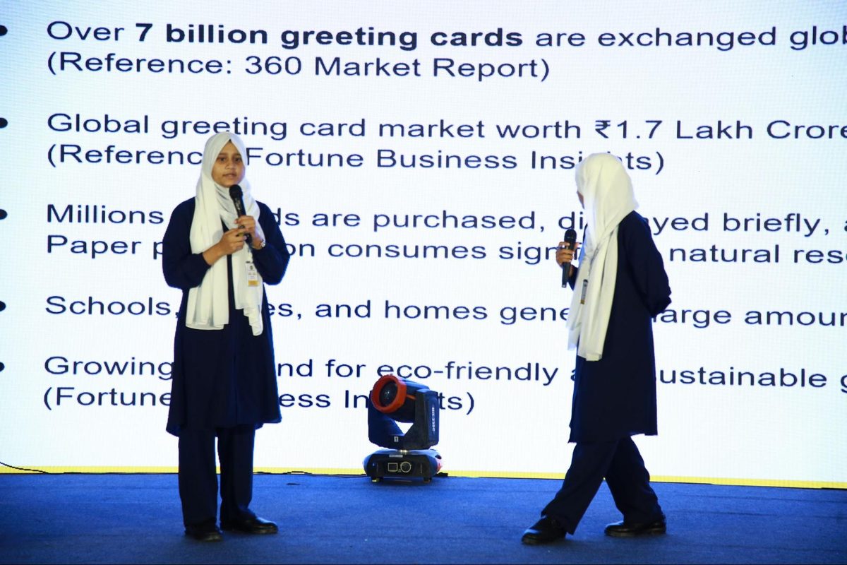 Two students from Umeed Global School presenting a greeting-card idea