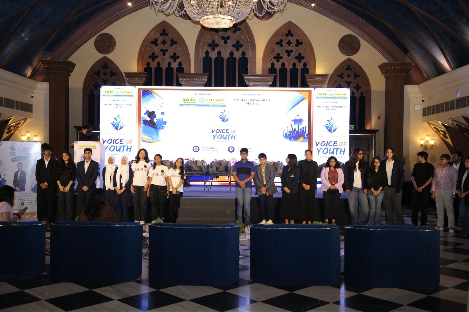 Student participants lined up on stage at Raajkutir in front of the Voice of Youth Summit 2026 backdrop