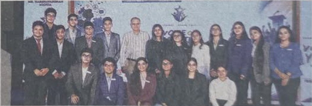 The organising team of Voice of Youth posing together on stage