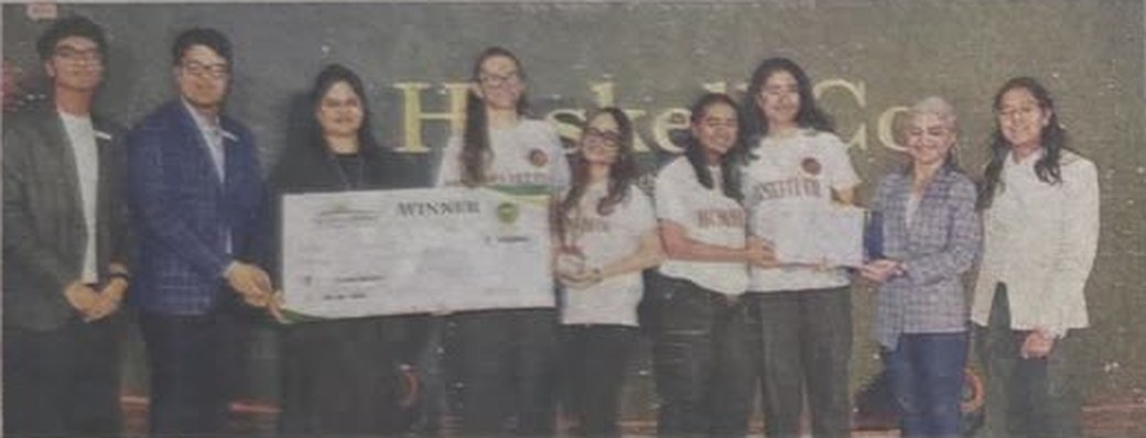 The Huskell Co. team with their winner's cheque